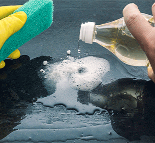 Surfactant solution being used with a sponge for cleaning products - Chemical Market