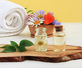 Beauty oils with towel and flower for skin repair and eco-friendly skincare appeal
