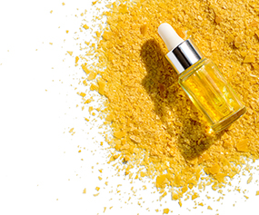 Dropper bottle with yellow powder representing emulsifiers for product stability